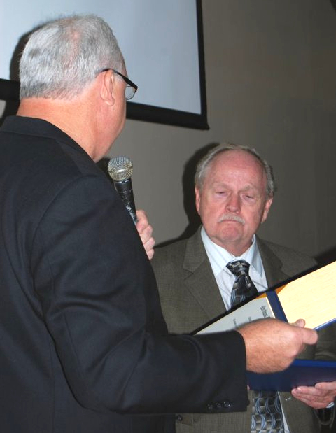Picture of Dave Harrison receiving an award