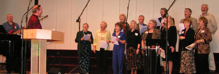 60's Alums singing at alumni hymnsing may 2005