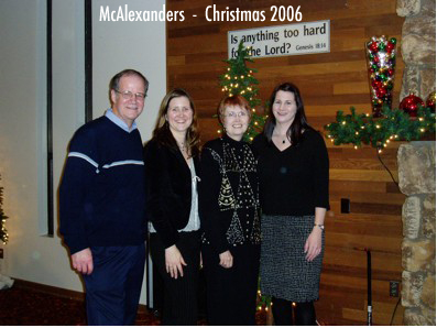 Picture of Norm, Judi, and their daughters Christmas 2006