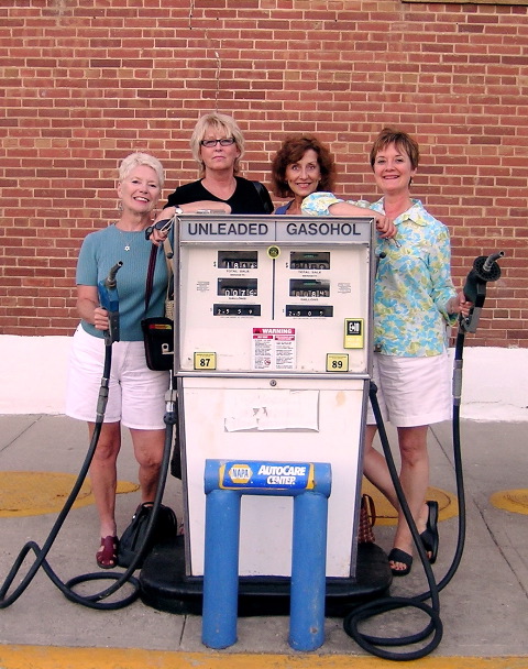 picture of the four girls by the gas pump
