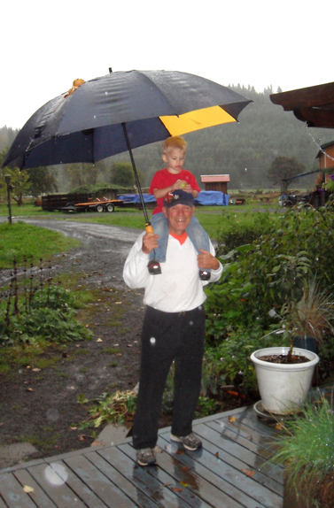 Ray with grandson Kaden under the umbrella