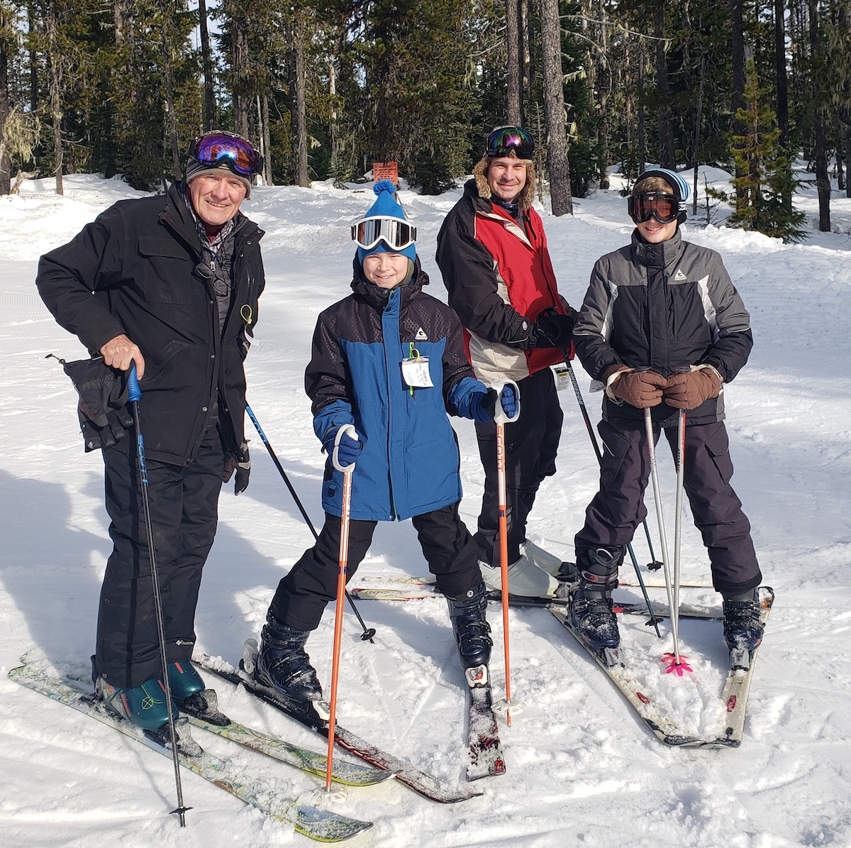 Ray, Thano and kids skiing